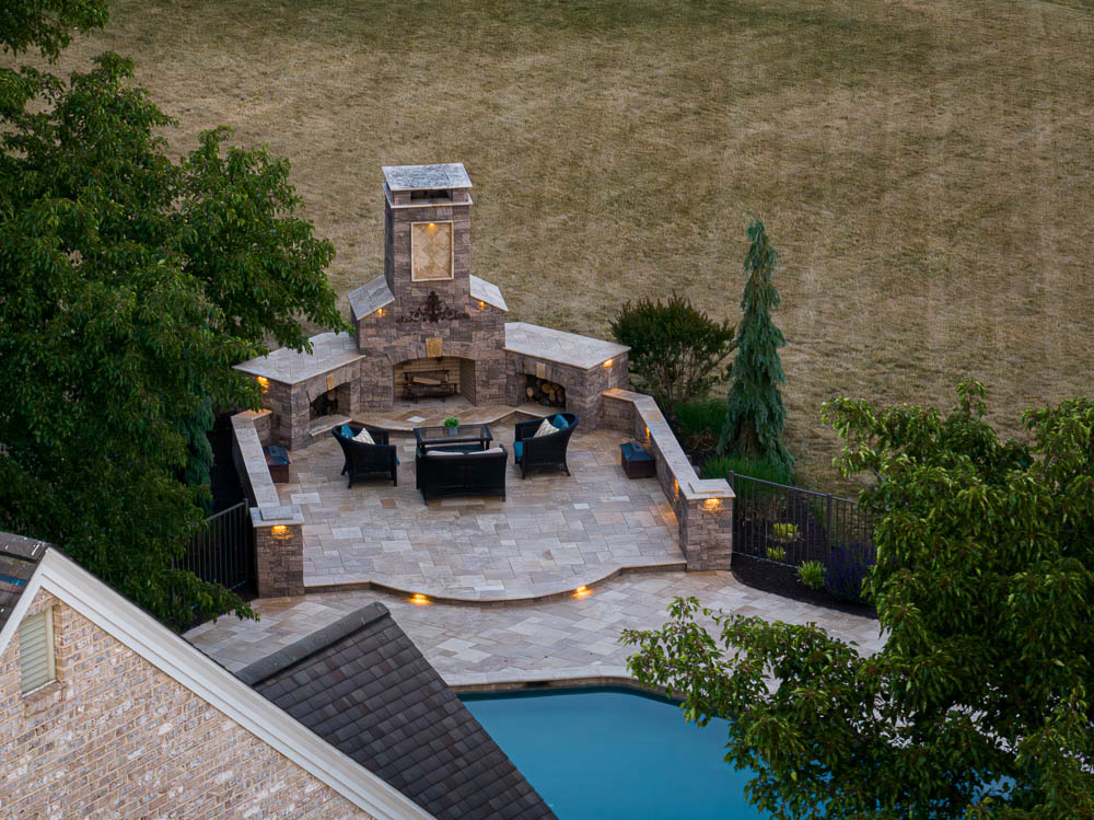 Masonry outdoor cooking area beside a patio