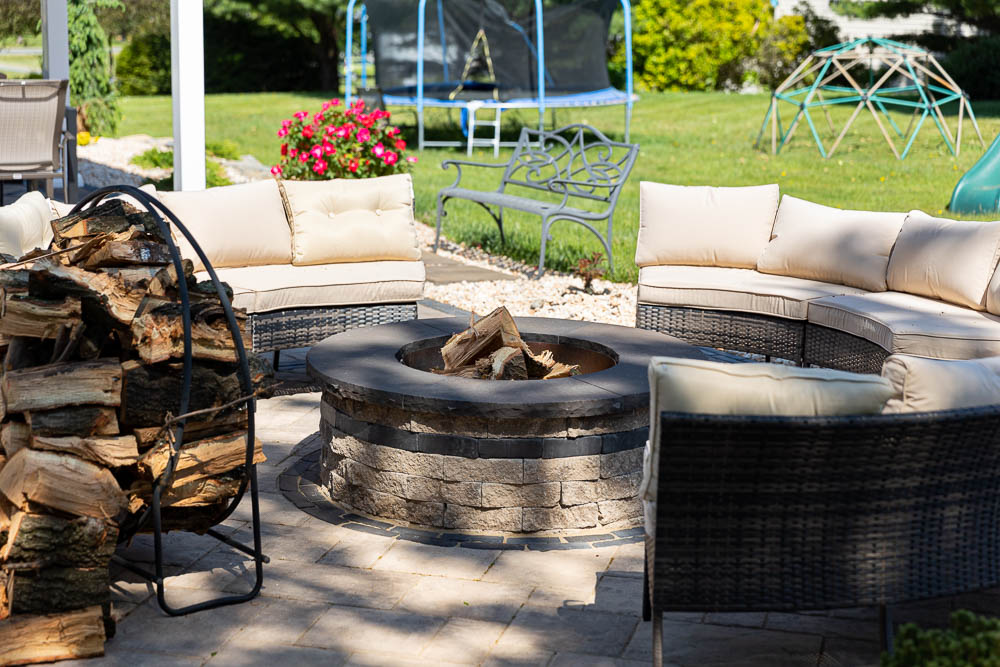 Outdoor chairs around a round fire pit