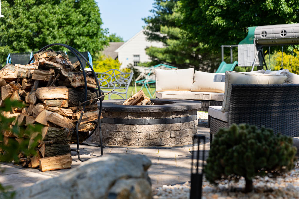 Fire pit with seating on a paved patio