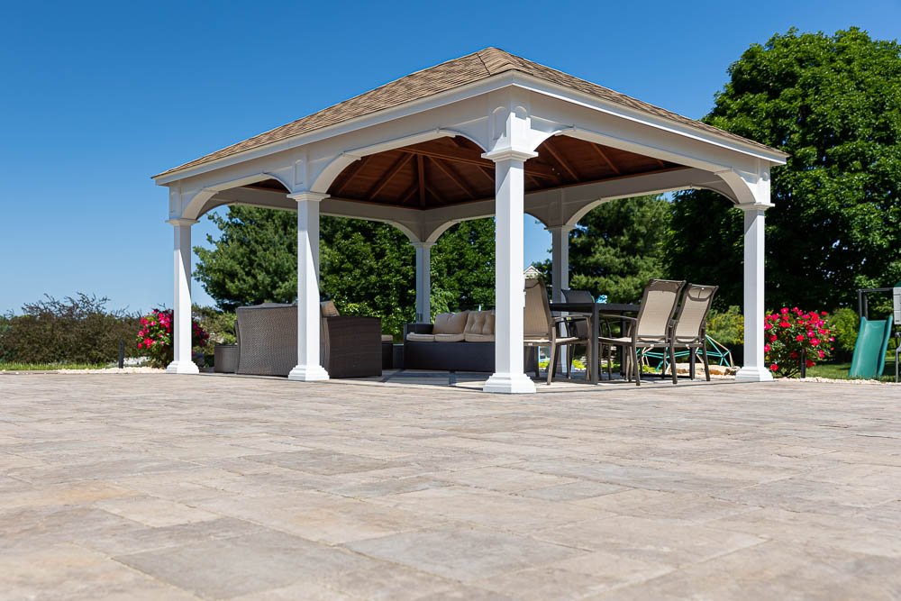 Open-sided roofed pavilion beside a pool