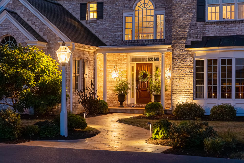 Planted bed beside a house entrance and walkway