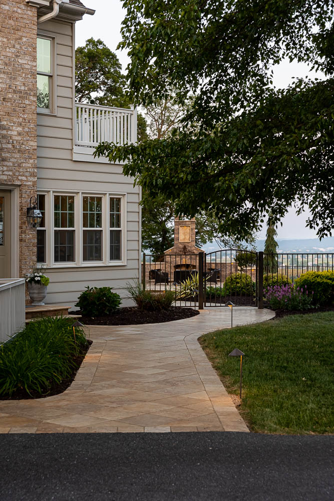 Shrubs and flowers along a hardscape edge