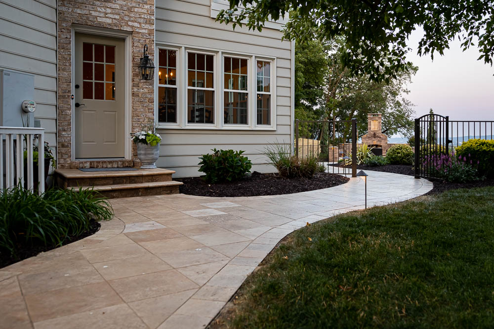 Entrance steps beside a planted bed